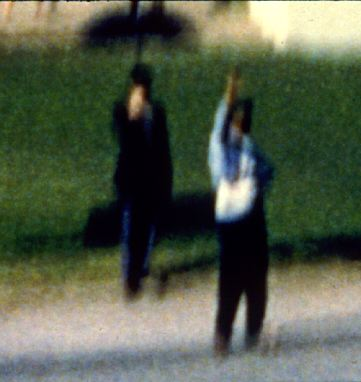 Illustration for article titled Why Conspiracy Theorists Are So Obsessed With JFK's "Umbrella Man"